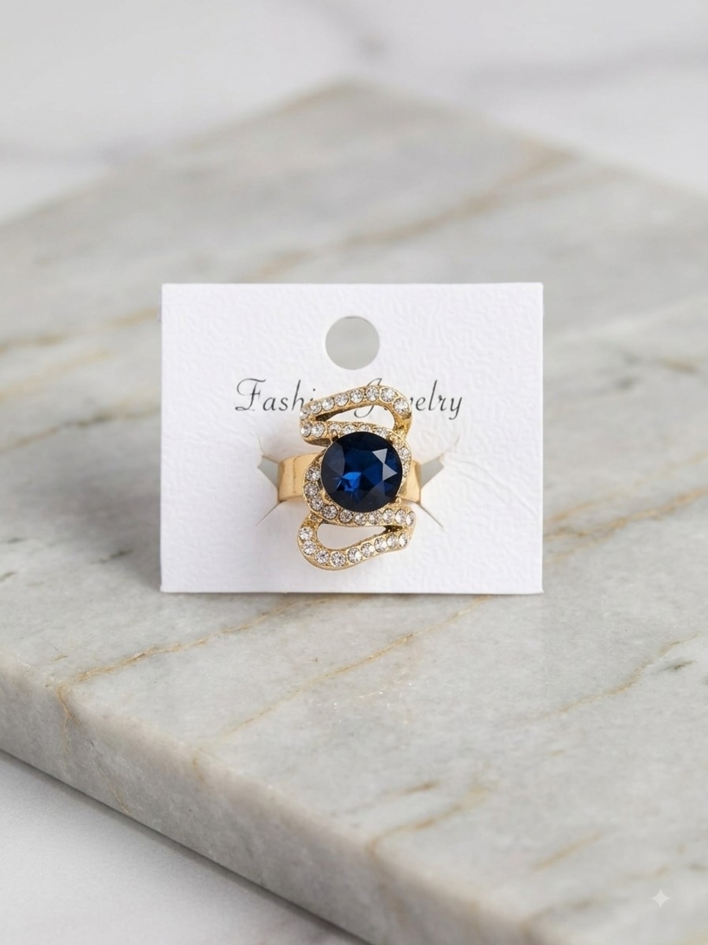 Gold Ring with Deep Blue Stone and Crystal Accents